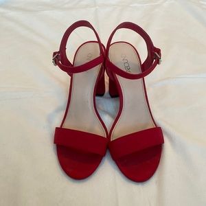 Red strappy block heel.